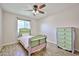 Bright bedroom features light walls, a ceiling fan, and a nice bed set at 7125 W Canterbury Dr, Peoria, AZ 85345