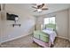 Bright bedroom features light walls, a ceiling fan, and a nice bed set at 7125 W Canterbury Dr, Peoria, AZ 85345
