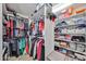 Organized walk-in closet with ample shelving and hanging space for clothes and accessories at 7125 W Canterbury Dr, Peoria, AZ 85345