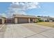 Charming single-story home with a well-maintained front yard, complemented by a two-car garage and inviting curb appeal at 7125 W Canterbury Dr, Peoria, AZ 85345