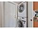 Convenient laundry area with a stacked washer and dryer at 7125 W Canterbury Dr, Peoria, AZ 85345