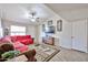 Cozy living room with vaulted ceilings, wood-look flooring, and a comfortable seating area, creating a cozy ambiance at 7125 W Canterbury Dr, Peoria, AZ 85345