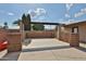 Outdoor patio area featuring a brick structure, perfect for entertaining and relaxing at 7125 W Canterbury Dr, Peoria, AZ 85345