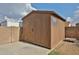 Durable wooden shed offering secure storage space in the backyard at 7125 W Canterbury Dr, Peoria, AZ 85345