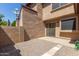 Backyard featuring a gravel area, block wall, and exterior of home at 7977 W Wacker Rd # 253, Peoria, AZ 85381
