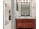 Elegant bathroom vanity with marble countertop, modern fixtures, and a decorative mirror at 7977 W Wacker Rd # 253, Peoria, AZ 85381