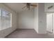 Spacious carpeted bedroom with a ceiling fan and natural light at 7977 W Wacker Rd # 253, Peoria, AZ 85381