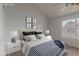 Comfortable bedroom featuring a queen bed, soft linens, and a bright window at 7977 W Wacker Rd # 253, Peoria, AZ 85381