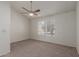Spacious bedroom with carpet flooring, natural light, and ceiling fan at 7977 W Wacker Rd # 253, Peoria, AZ 85381