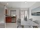 Bright dining area with modern table and stainless steel appliances, perfect for Gathering meals and entertaining at 7977 W Wacker Rd # 253, Peoria, AZ 85381