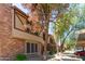 Attractive townhome boasting brick accents, covered parking, and mature trees for shade at 7977 W Wacker Rd # 253, Peoria, AZ 85381