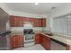 Well-equipped kitchen with stainless steel appliances, ample cabinet space, and granite countertops for easy cooking at 7977 W Wacker Rd # 253, Peoria, AZ 85381