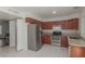 Kitchen with stainless steel appliances, tile floors, and white walls for a simple and modern look at 7977 W Wacker Rd # 253, Peoria, AZ 85381