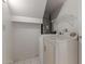 Bright laundry room features a side-by-side washer and dryer, shelving, and tiled floor at 7977 W Wacker Rd # 253, Peoria, AZ 85381