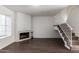 Bright living room with a fireplace and staircase leading upstairs, offering an inviting space at 7977 W Wacker Rd # 253, Peoria, AZ 85381
