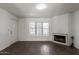 Inviting living room features a cozy fireplace, tiled floors, and large windows offering ample natural light at 7977 W Wacker Rd # 253, Peoria, AZ 85381