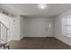 Spacious living room features tile flooring, staircase, and bright windows, perfect for modern living at 7977 W Wacker Rd # 253, Peoria, AZ 85381