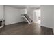 Open-concept living room with staircase, fireplace, and wood-look tile flooring at 7977 W Wacker Rd # 253, Peoria, AZ 85381