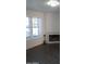Bright living room with a cozy fireplace, ample natural light, and elegant dark wood-look floors at 7977 W Wacker Rd # 253, Peoria, AZ 85381