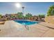 Well-maintained community pool with a covered pergola, desert landscaping, and ample sunbathing space at 7977 W Wacker Rd # 253, Peoria, AZ 85381
