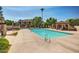 Sparkling community pool with covered seating area and desert landscaping for outdoor enjoyment at 7977 W Wacker Rd # 253, Peoria, AZ 85381
