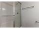 Bathroom features shower stall with glass doors and towel rack at 7977 W Wacker Rd # 253, Peoria, AZ 85381