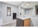 This bathroom features a granite vanity top and gray wood-look flooring at 8107 E Butte St, Mesa, AZ 85207