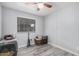 Smaller bedroom with neutral walls and a ceiling fan at 8107 E Butte St, Mesa, AZ 85207