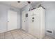 View of a bedroom showing the walls, floor, closet and a gun safe at 8107 E Butte St, Mesa, AZ 85207