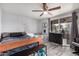 Bright Bedroom with a ceiling fan, neutral walls, and baby accessories at 8107 E Butte St, Mesa, AZ 85207
