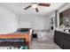 Bedroom with a ceiling fan, neutral walls, and baby accessories at 8107 E Butte St, Mesa, AZ 85207
