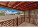View of the wooden back deck showing lattice work, and a wood ceiling at 8107 E Butte St, Mesa, AZ 85207