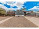 Charming single-story home with neutral-toned exterior, gravel landscaping, and gated entrance at 8107 E Butte St, Mesa, AZ 85207