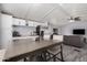 Open floor plan featuring kitchen with stainless steel appliances, dining area, and living space at 8107 E Butte St, Mesa, AZ 85207