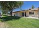 Relaxing backyard with a well-maintained lawn and covered patio, ideal for outdoor living at 8261 E Keats Ave # 396, Mesa, AZ 85209