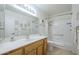 Bathroom features a shower and tub combination, a sink with a large mirror, and light neutral-toned walls at 8261 E Keats Ave # 396, Mesa, AZ 85209