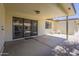 Spacious covered patio with sliding glass doors and neutral flooring, perfect for outdoor relaxation at 8261 E Keats Ave # 396, Mesa, AZ 85209