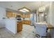 Bright kitchen with stainless steel appliances, wood cabinets, and ample counter space at 8261 E Keats Ave # 396, Mesa, AZ 85209