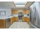 Contemporary kitchen featuring modern appliances, ample cabinet space, and tile flooring at 8261 E Keats Ave # 396, Mesa, AZ 85209