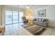 Bright living room with tile flooring, sliding glass doors, and comfortable seating area at 8261 E Keats Ave # 396, Mesa, AZ 85209