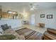 Open-concept living room featuring a kitchen view and comfortable seating arrangements at 8261 E Keats Ave # 396, Mesa, AZ 85209