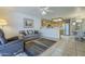 Open living room and kitchen area with tile flooring and modern stainless steel appliances at 8261 E Keats Ave # 396, Mesa, AZ 85209