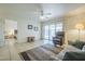 Spacious living room with tile floors, slider to outdoor patio, and neutral paint at 8261 E Keats Ave # 396, Mesa, AZ 85209