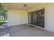 Covered patio with sliding glass door to home, and storage unit door at 8261 E Keats Ave # 396, Mesa, AZ 85209
