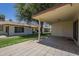 Backyard view with covered patio, grass, and paver flooring at 8261 E Keats Ave # 396, Mesa, AZ 85209