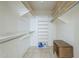 Walk-in closet with custom shelving, hanging rods, and ample storage space at 8261 E Keats Ave # 396, Mesa, AZ 85209