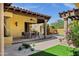 Charming backyard patio with outdoor seating, lush landscaping, and a view of the refreshing pool at 9290 E Thompson Peak Pkwy # 409, Scottsdale, AZ 85255