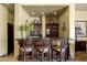 Bar with ornate stools, cabinetry, and recessed lighting at 9290 E Thompson Peak Pkwy # 409, Scottsdale, AZ 85255