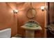 Charming powder room with a decorative sink, unique mirror, and rustic design elements for a cozy feel at 9290 E Thompson Peak Pkwy # 409, Scottsdale, AZ 85255