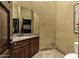 Elegant powder room with a unique mirror, granite countertop, and stylish fixtures for a luxurious touch at 9290 E Thompson Peak Pkwy # 409, Scottsdale, AZ 85255